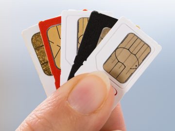 Person holding SIM cards