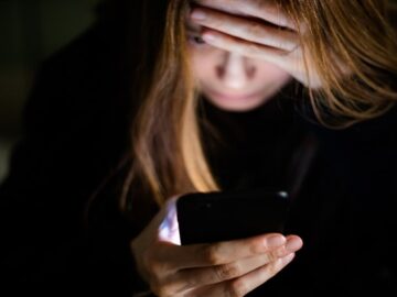 PartnerLeak scam site promises victims full access to “cheating” partner’s stolen data Woman with head in her hands