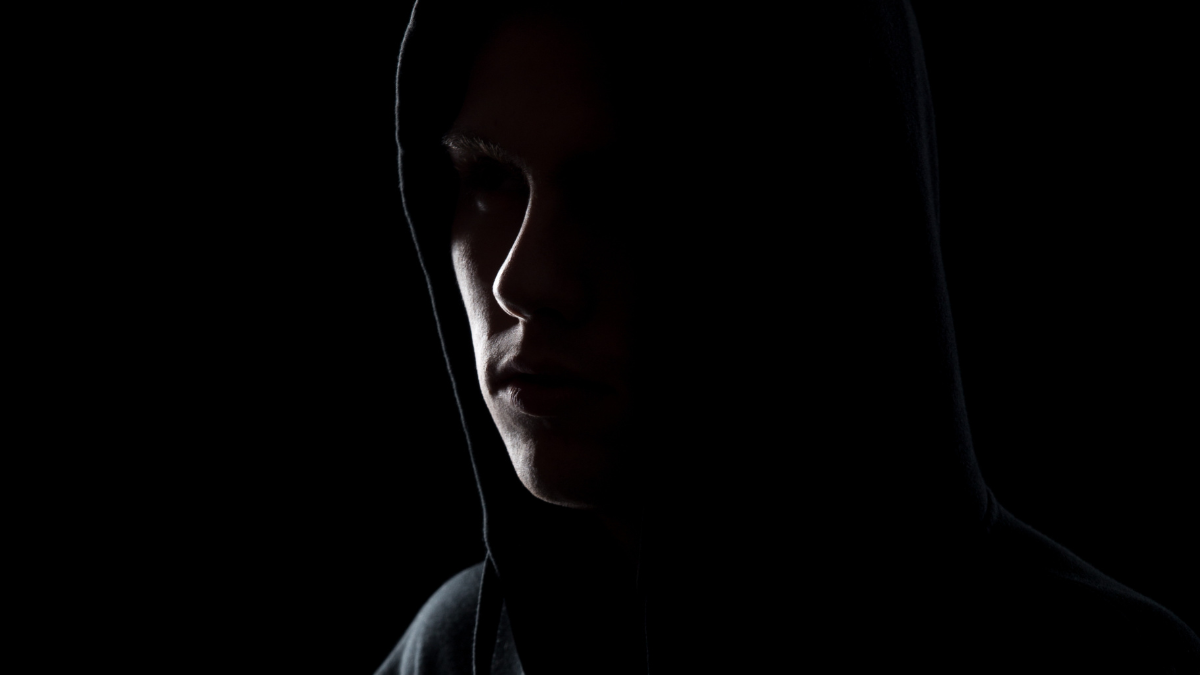 Child predators are lurking on dating apps, warns report Image of man in the shadows