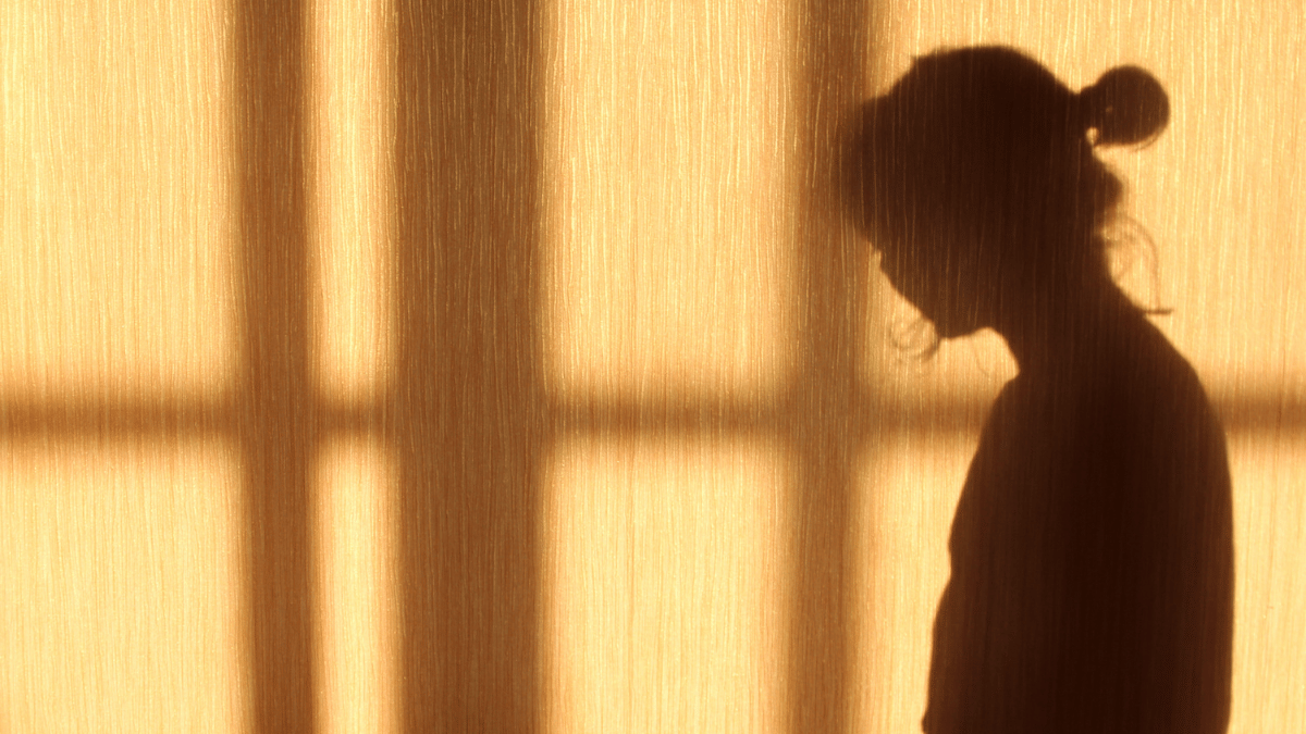 Deepfake-posting man faces huge $450,000 fine Shadow of woman looking side on