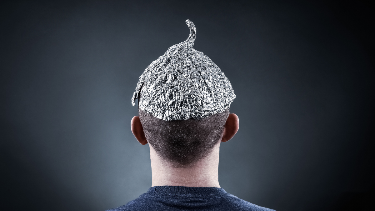 No we didn’t warn all Gmail users about imminent digital doom, says Google A man facing away from the camera wearing a tin foil hat